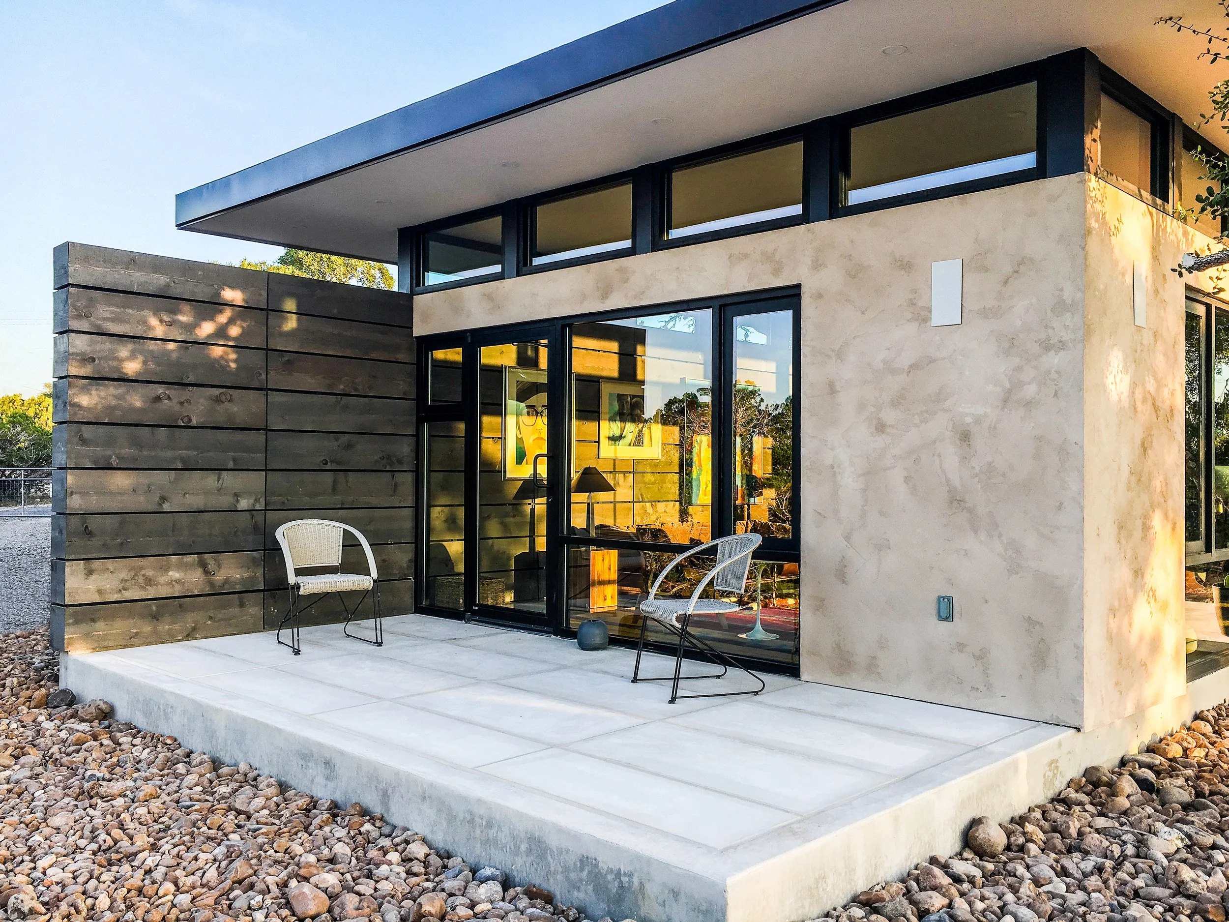 Alta Luz living area with glass doors and wood ceiling