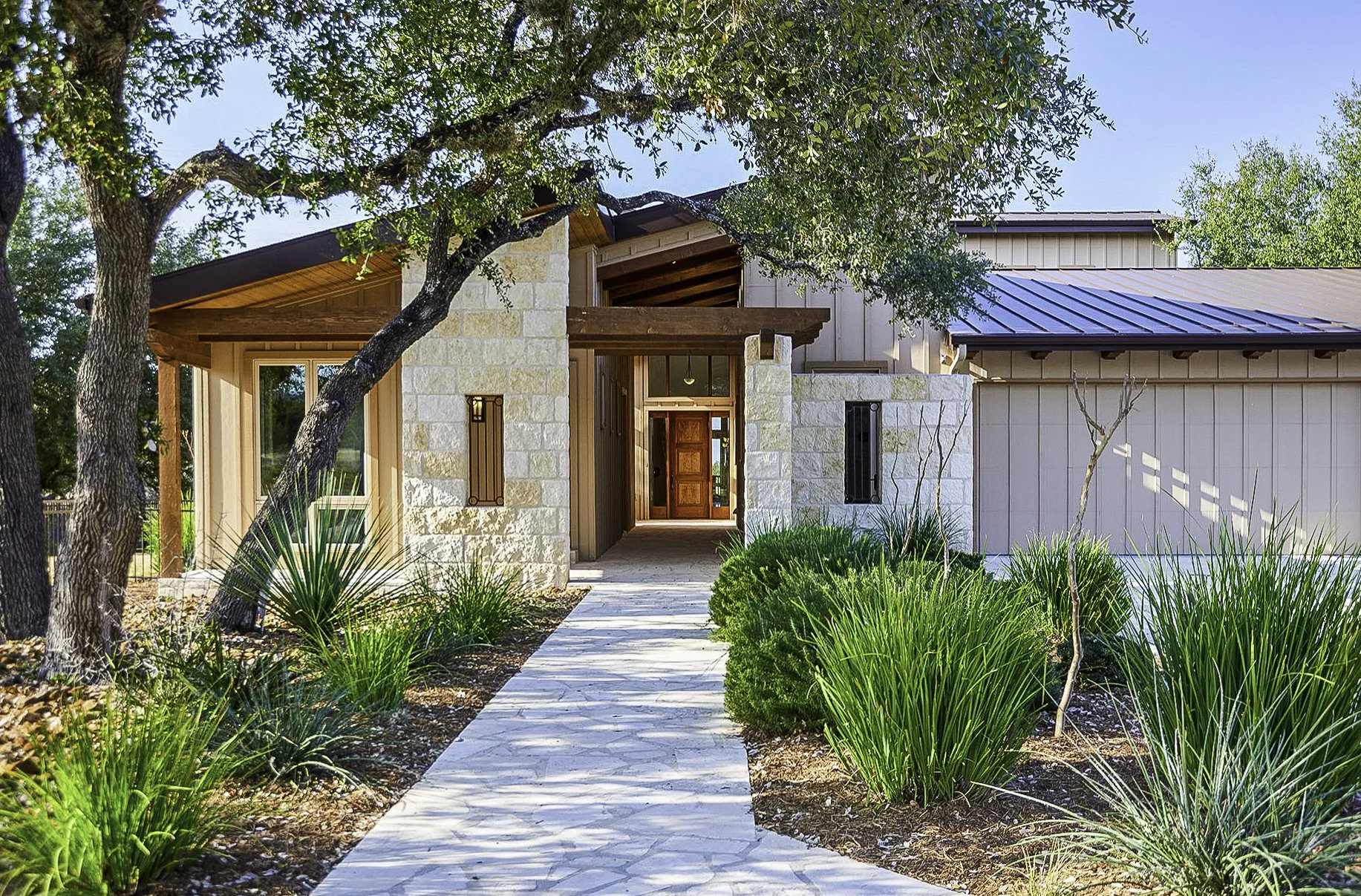 Alta Luz interior with wooded Hill Country views