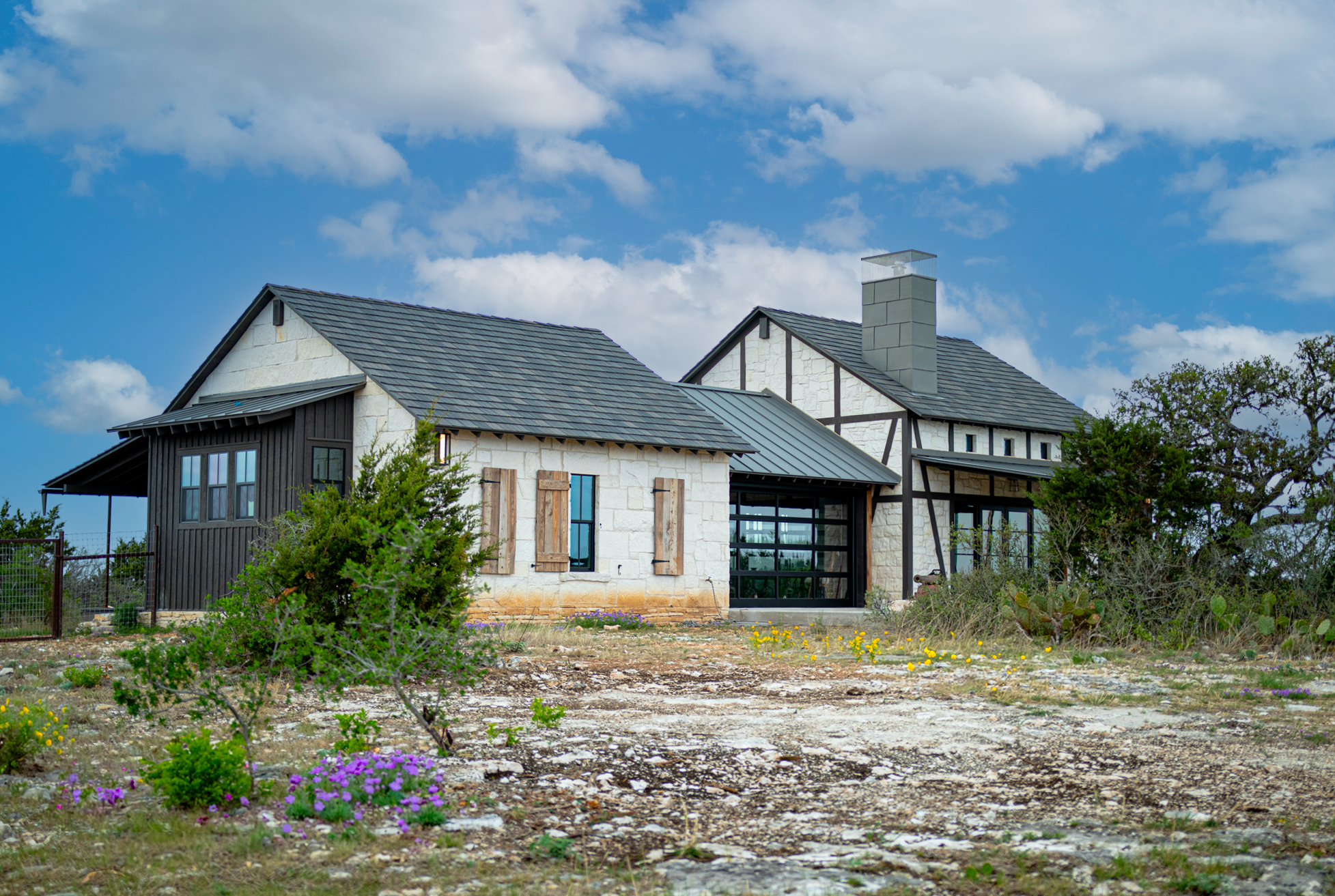 Dogtrot Cabin exterior with Hill Country landscape