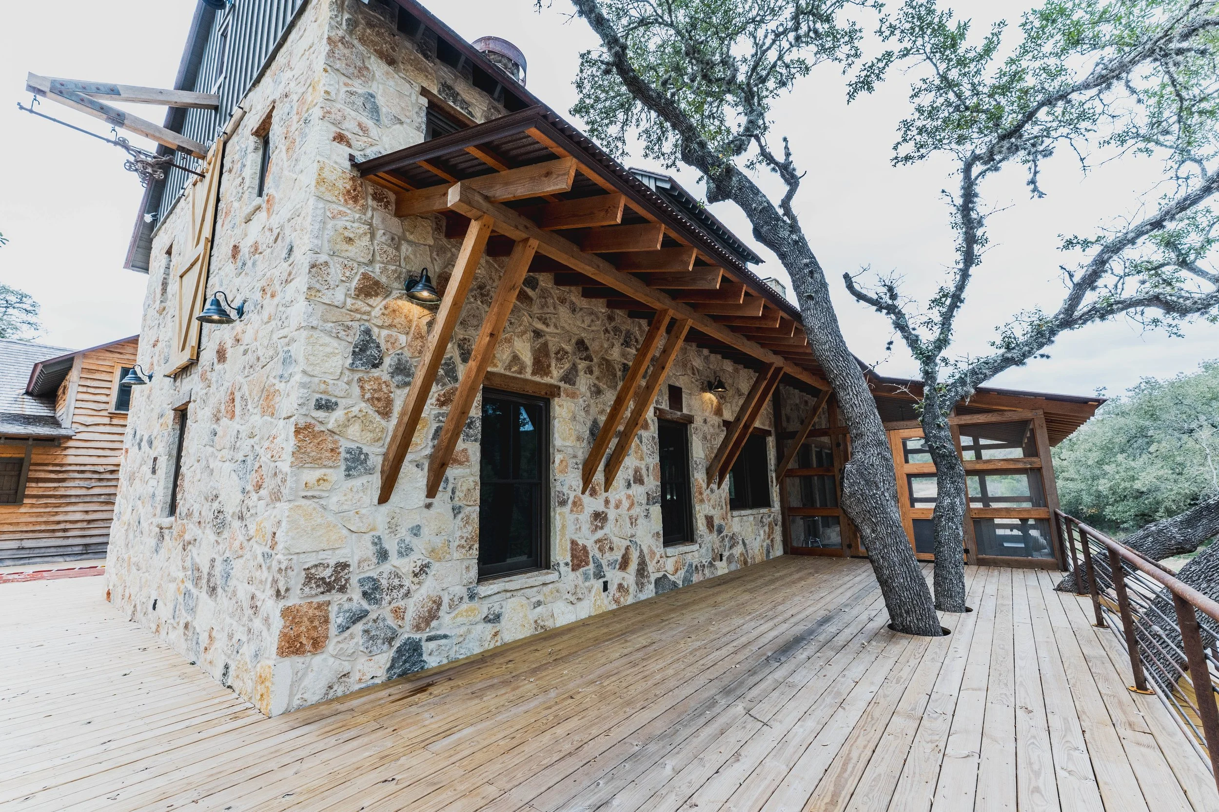 H2 Lodge interior with layered stone and timber