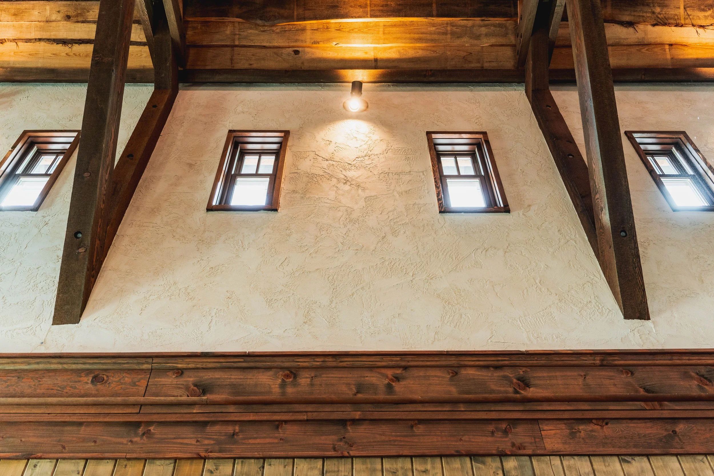 H2 Lodge stone exterior wall and roof detail