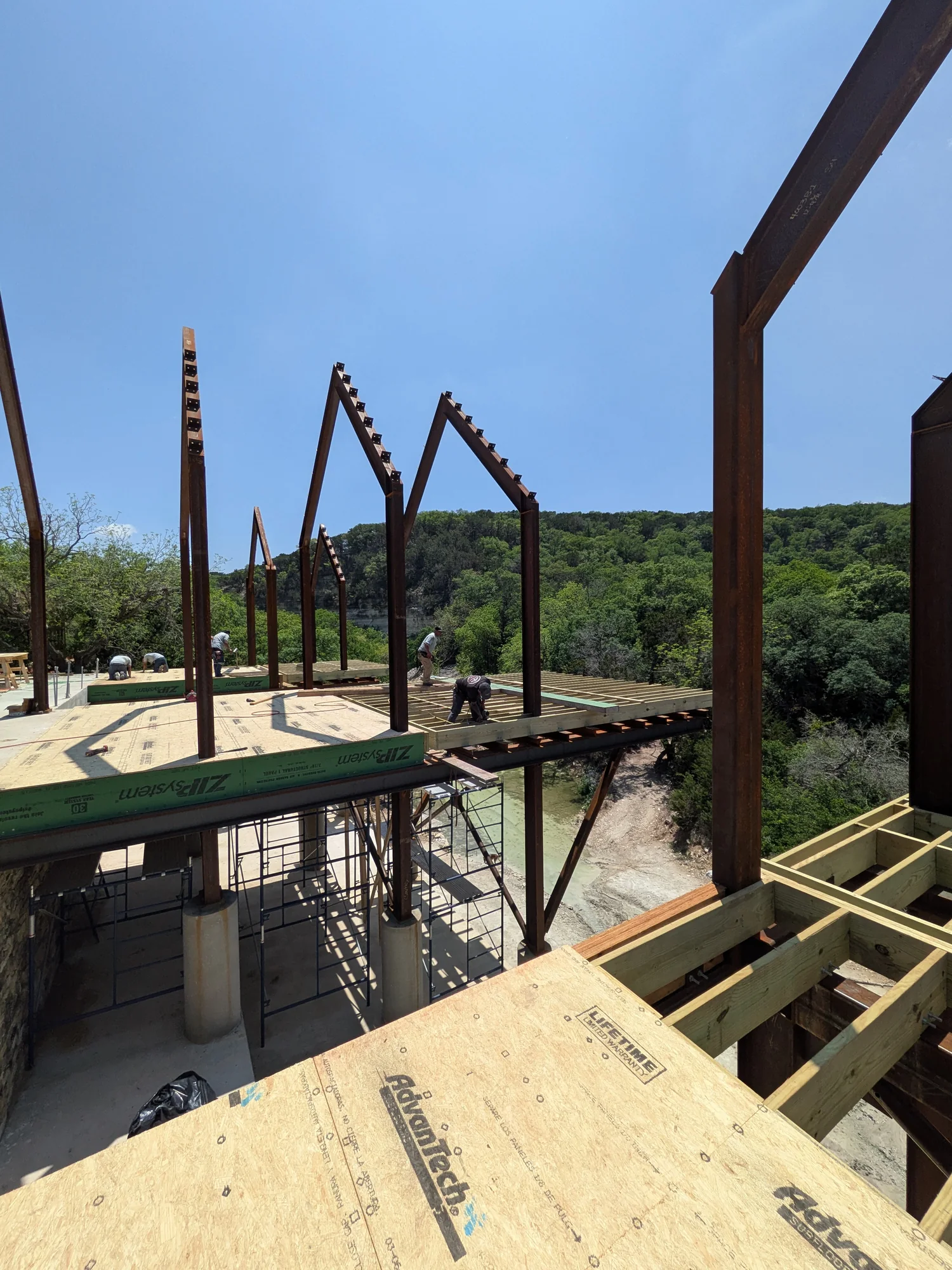 Arroyo Verde deck framing and steel frames above the creek corridor