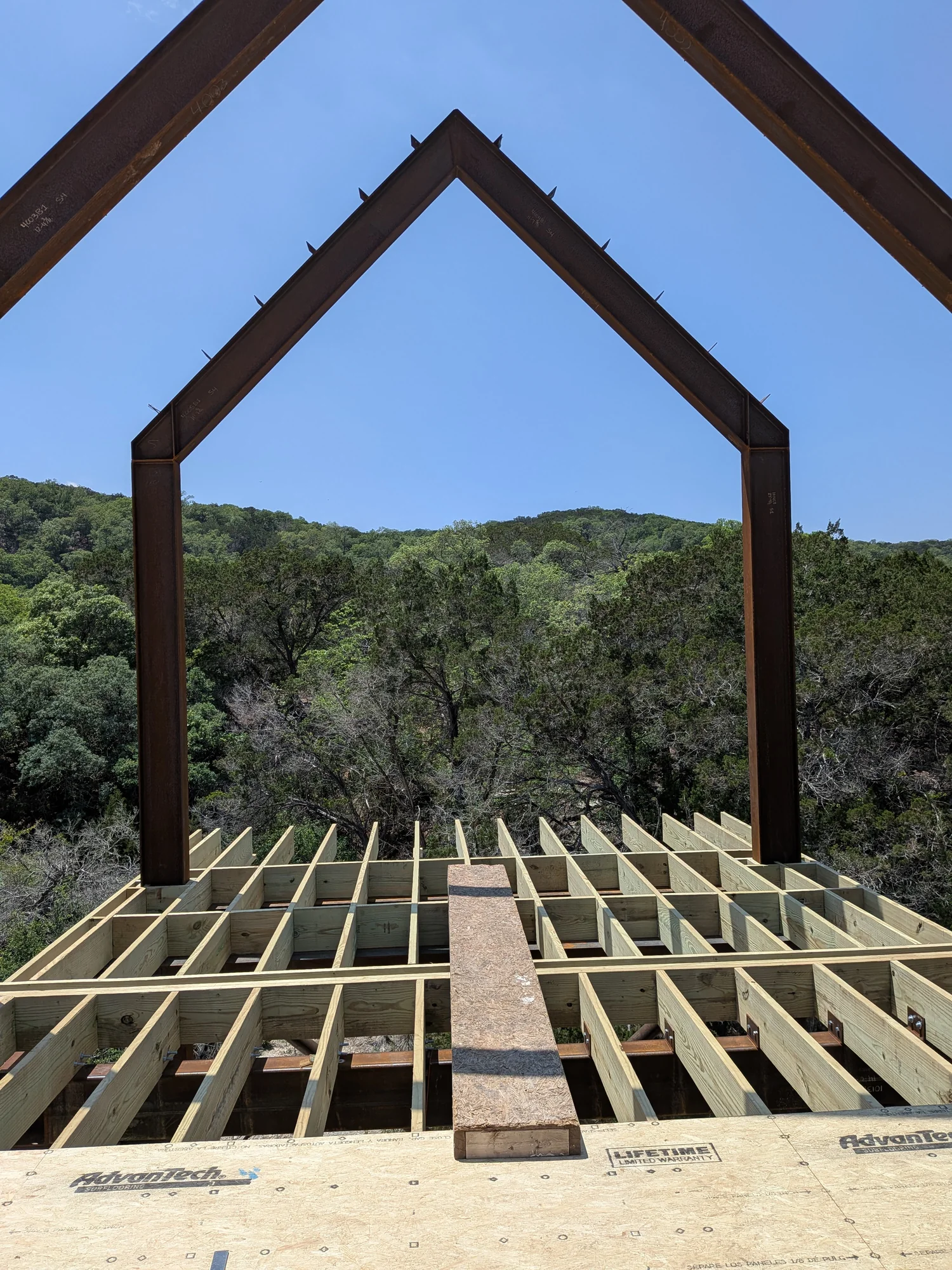 Arroyo Verde stone basework, concrete, steel, and deck framing in progress